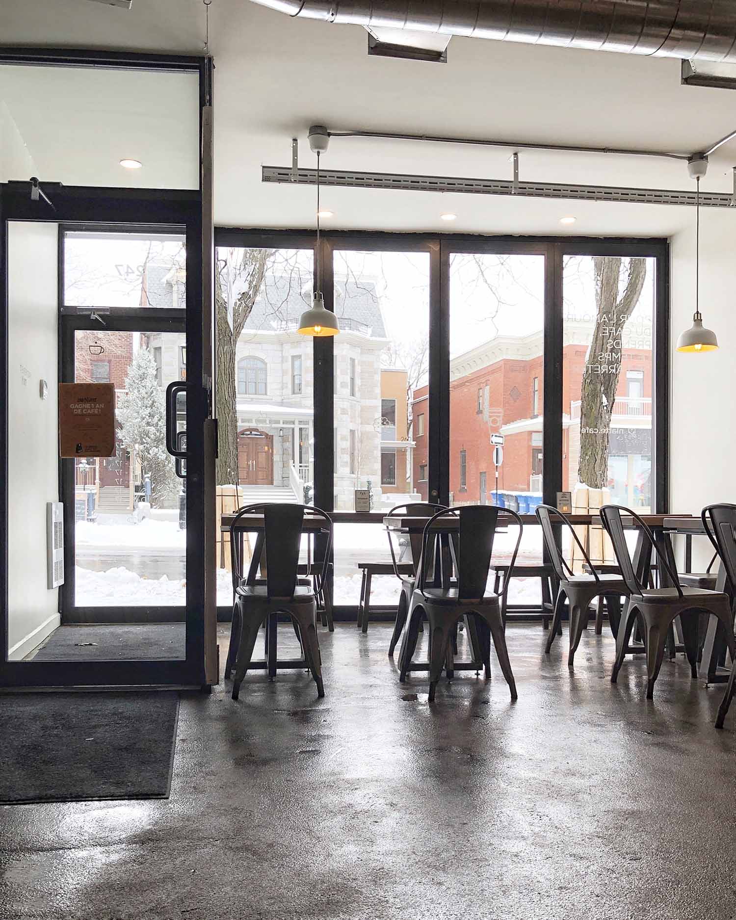 a cafe with tables and chairs